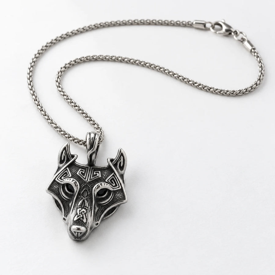 Wolf matching necklace on a white background.